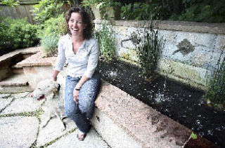 Phyllis Warman sits with her dog