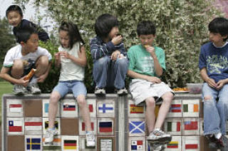 A group of kids enjoyed an afternoon snack al fresco at Crossroads Park on Monday