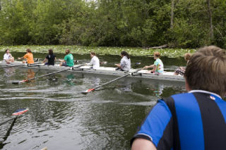 13-year-old Ryan Coulter of Bellevue watches as one crew pulls away from the dock.