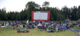 A crowd gathers with blankets and lawn chairs for one of the “Movies @ Marymoor” nights last year at Marymoor Park
