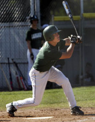 Lakeside’s Grant Gellatly gets a hit against Bankers Baseball Club.