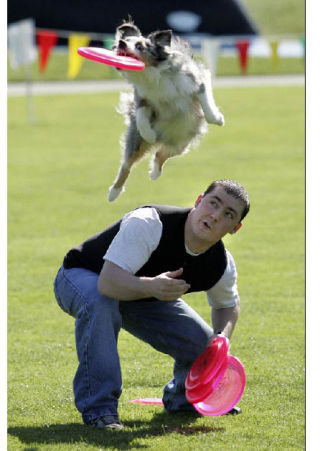 Jake Motzkus and his dog Jada partipate in The Hyperflite Skyhoundz World Canine Disc Championship Series Regional Qualifiers event at Crossroads Park on Saturday