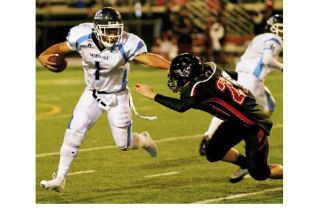 Brett Kirschner avoids a Sammamish defender in Interlake’s 55-17 win in the 2008 Crossroads Cup. Kirschner rushed for 235 yards and four touchdowns in the win.