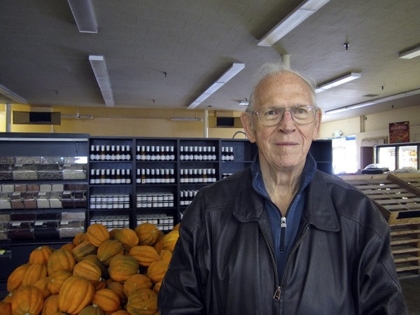 Bill Pace stands in front of a display of squash. He’s still waiting on several permits before he can open his store