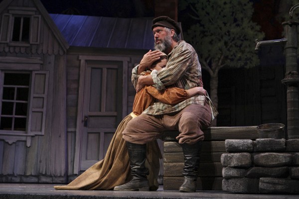 Tevye (played by Eric Polani Jensen) embraces daughter Tzeitel (played by Jennifer Weingarten) after she tells him she does not want to marry the butcher