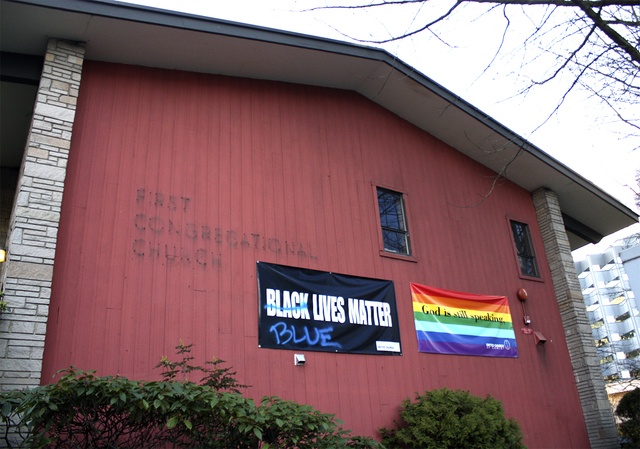 Allison DeAngelis/staff photo The defaced “Black Lives Matter” banner on the east-facing exterior wall of the First Congregational Church in Bellevue.