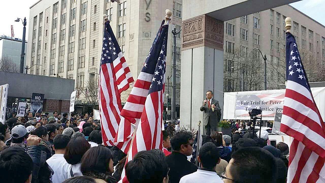 Bellevue resident and city council member Conrad Lee speaks to a crowd at a rally for Peter Liang