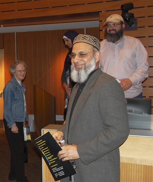 Ejaz Yusaf (center) and Ahmed Azmy (right) spoke to residents about their lives on March 16.