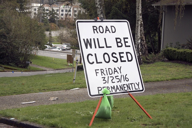 Signs posted on Southeast First Place warn residents that the road will be shut for good on Friday.