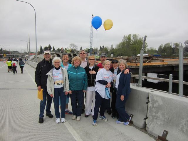 Several of Bellevue High School class of 1964 stop for a photo on the 520 bridge