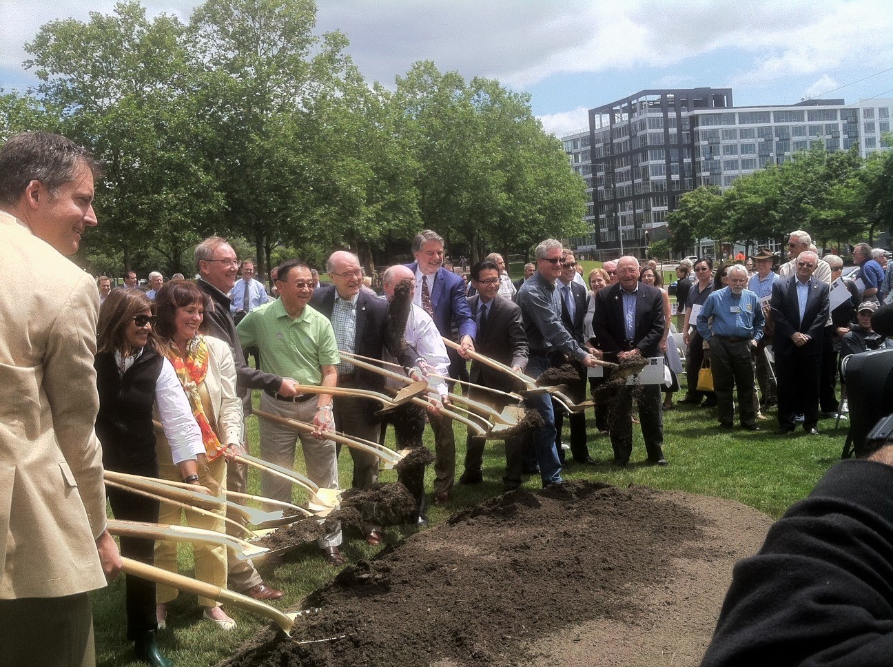 City and regional leaders and Bellevue Rotary members break ground Tuesday afternoon on the Inspiration Playground in Bellevue Downtown Park.