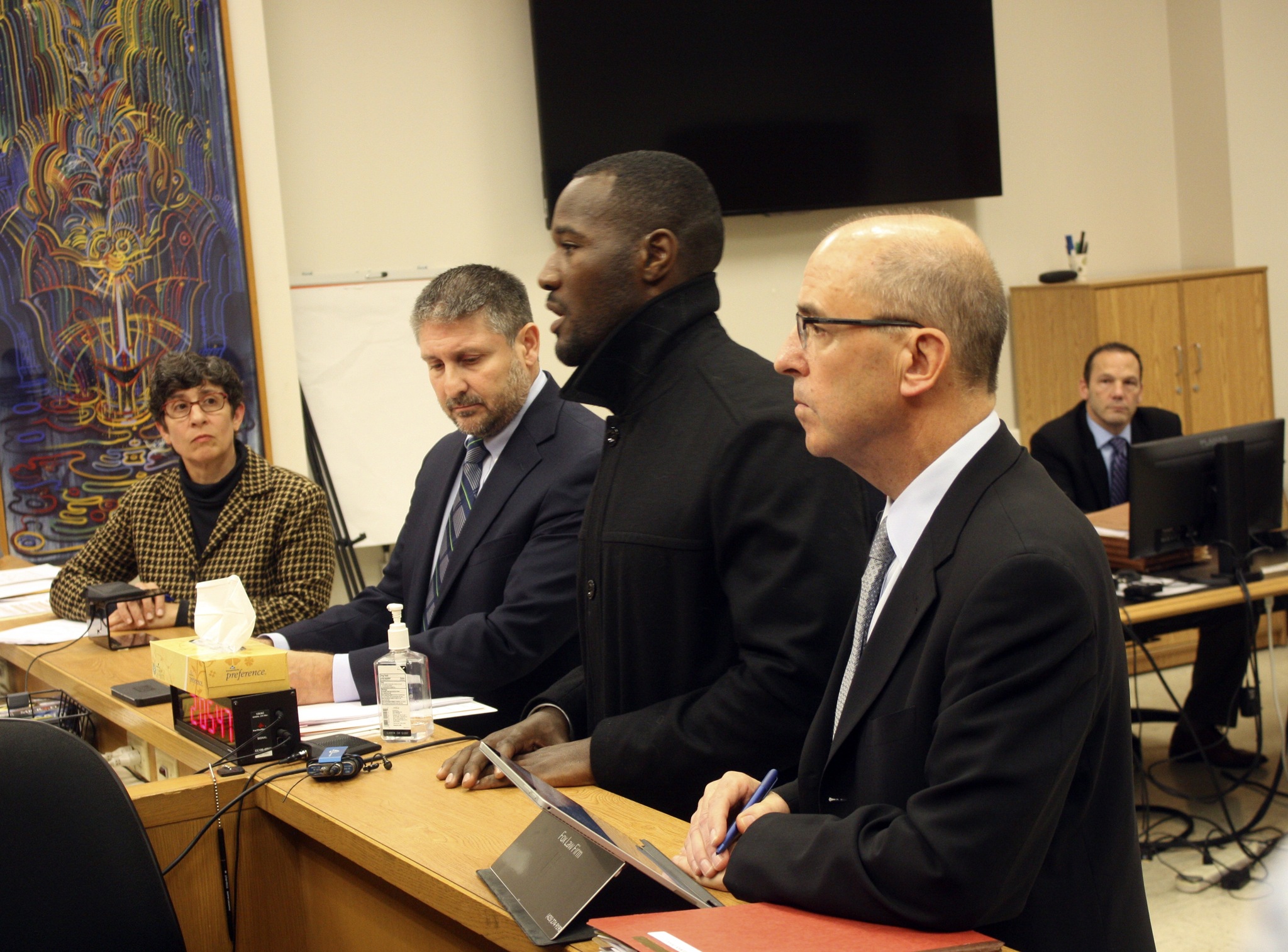 Former Seattle Seahawks player Derrick Coleman (second from the right) speaks to the judge during his sentencing hearing on Friday at the King County Superior Courthouse. Carrie Rodriguez/staff photo