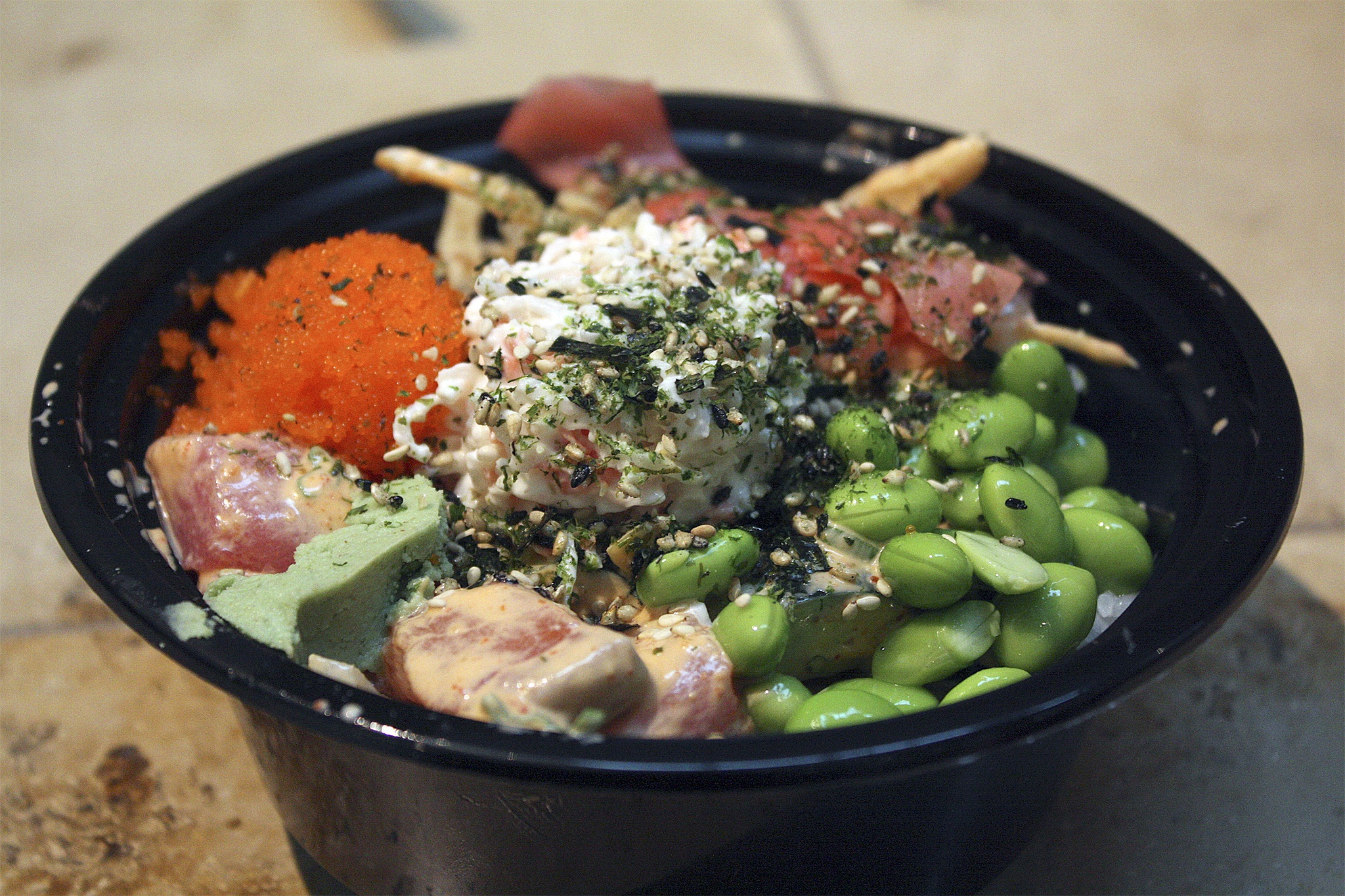 This salmon and tuna poke bowl with spicy miso sauce is standard fare at Bellevue's Poke MIX