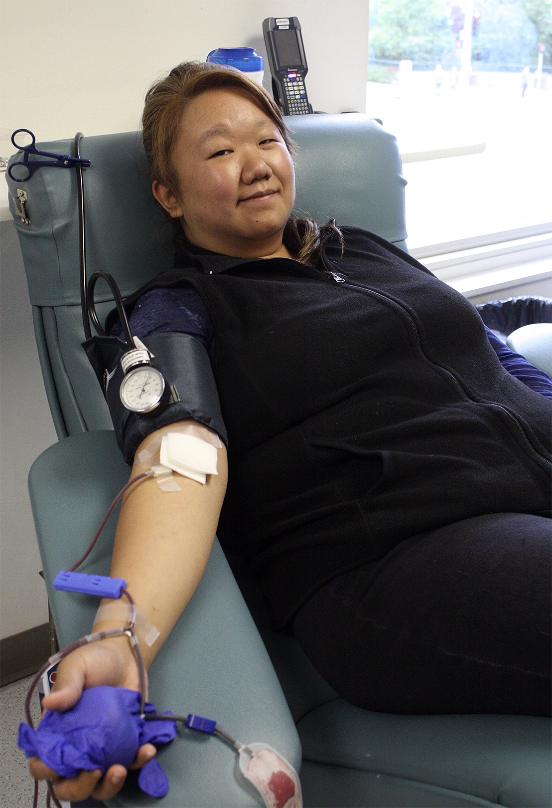 A local woman donates blood at Bloodworks Northwest