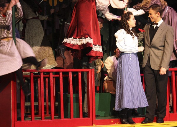 Kristen Ronhovde (as Esther Smith) and Jonathan Backous (as John Truett) perform in International School’s production of “Meet Me In St. Louis.”