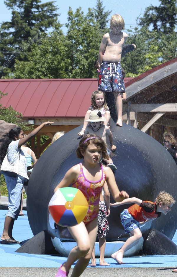 Kids of all ages and sizes packed the Crossroads International Park on Wednesday as temperatures pushed into the upper 80s in Bellevue. That summer feeling is expected to continue into the weekend.