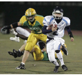 Interlake quarterback tries to scramble for yards against Lynden on Saturday night. The Lions forced the sophomore to throw five interceptions in the game.
