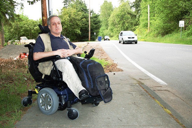 Jay Karns pauses near the corner of 134th Avenue Northeast and Northeast Eighth Street