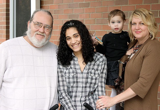 Joe Ingram stands with Casi Jackson and Julie Nelson