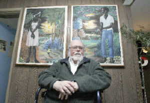Bob Olson will give the two paintings to an author from Haiti.