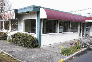 A For Lease sign in the window of the former Stamos Cafe in the Lake Hills Shopping Center says the popular restaurant won’t be returning after a devasting fire last year.