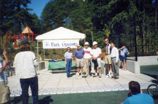 Tony Valentino (third from left) and Ed Mortensen (fourth from left) stand with city officials at the grand opening of the Cherry Crest Mini Park.