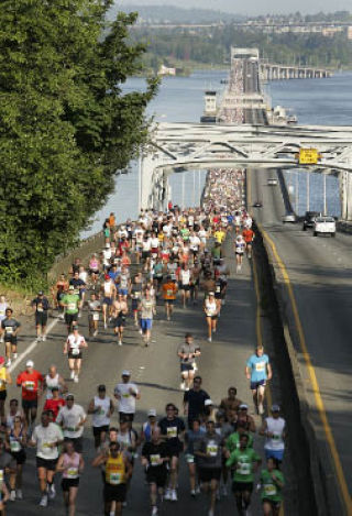 Runners cross the 520 floating bridge to Bellevue during the Virginia Mason Team Medicine Seafair Marathon.