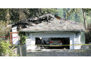 The burned remains of the home of congressional candidate Darcy Burner.