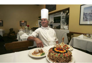 Walter Walcher has been cooking for and meeting customers at his restaurant for 25 years.