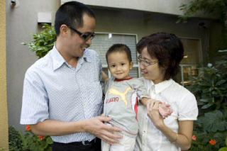 Adoptive parents Phung Quang Nghinh