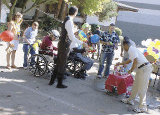 Volunteers from AT&T gathered at the Elder and Adult Day Services in Bellevue on Friday