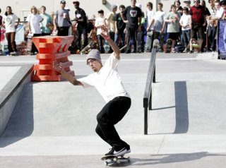 A pro skater demonstrates his skills at Highland Skate Plaze