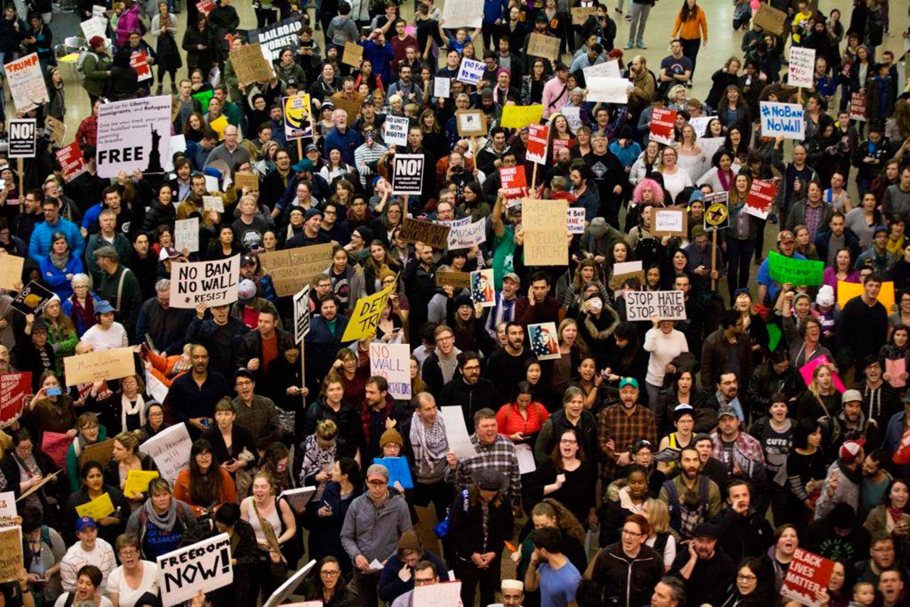 Hundreds protest the new federal immigration ban at SeaTac Airport over the weekend (Alex Garland/Seattle Weekly).