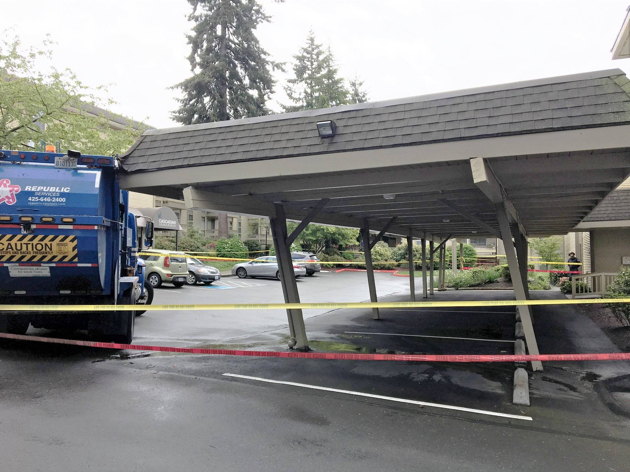 Bellevue Fire Department evacuates apartment after garbage truck damages carport