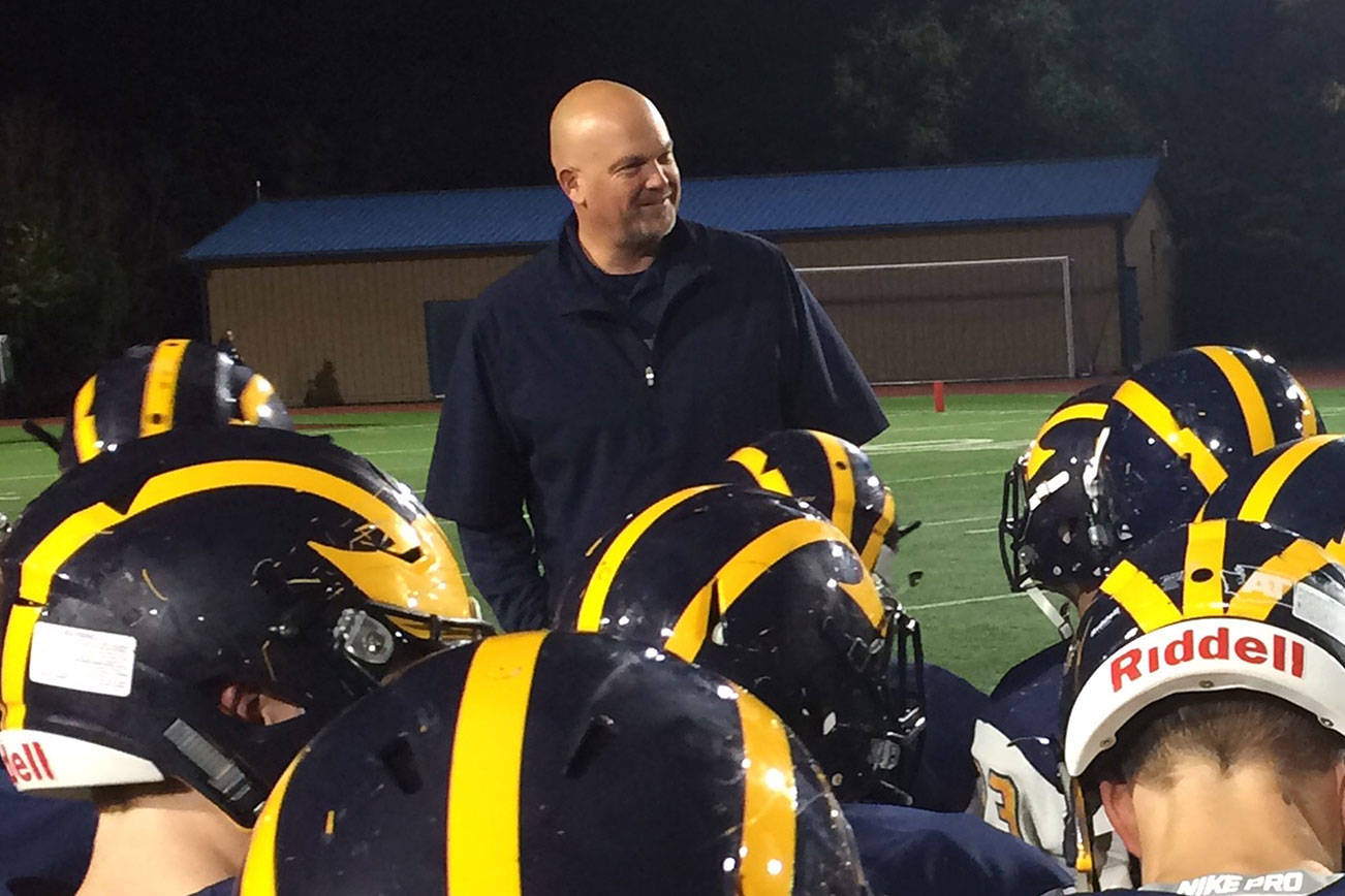 Shaun Scott, staff photo                                Bellevue Wolverines head football coach Mark Landes congratulates his team following their convincing 45-13 triumph against the Lake Washington Kangaroos in the final regular season home game of the 2017 season on Oct. 27 at Bellevue Memorial Stadium.