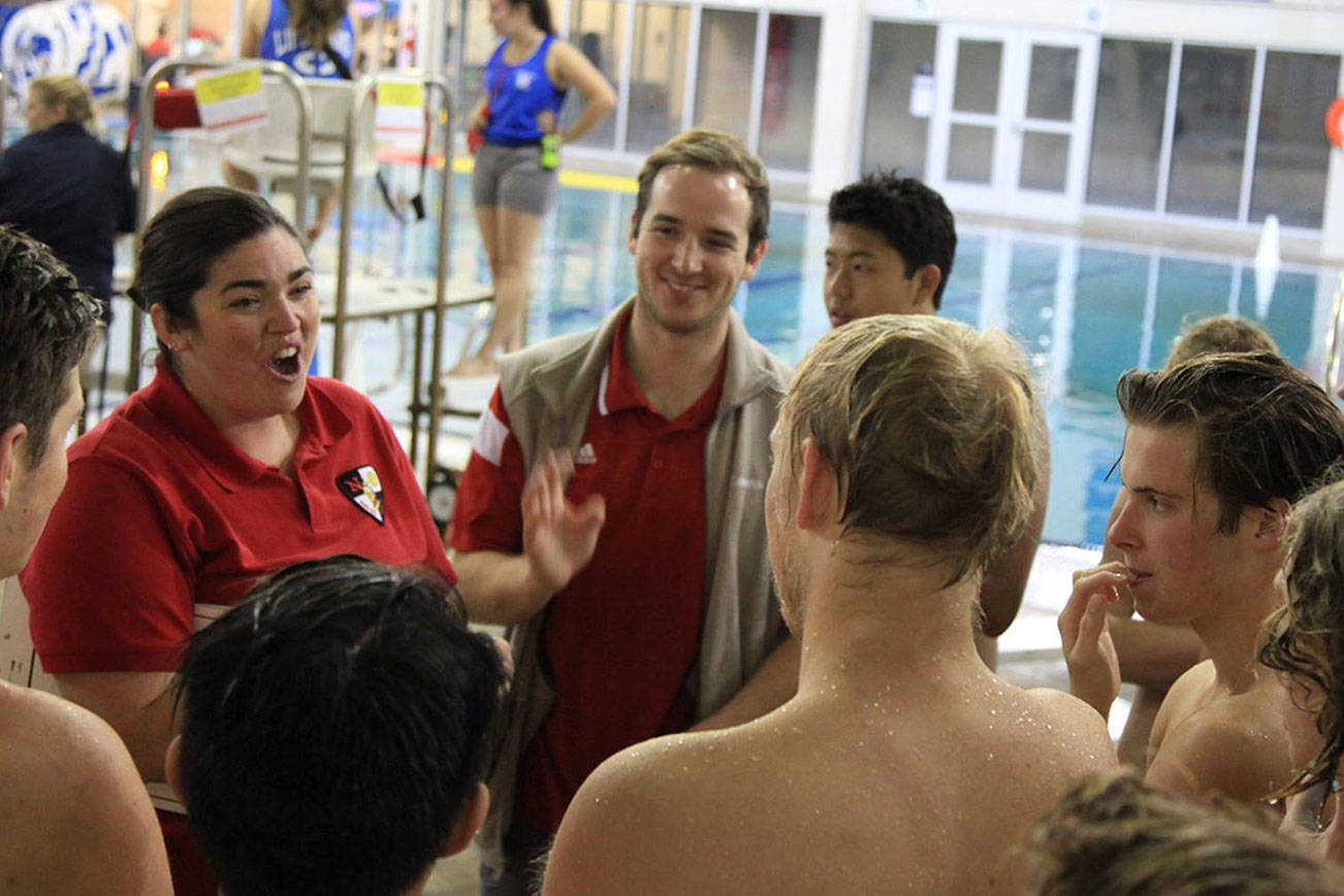 Photo courtesy of James Liu                                Newport Knights boys water polo head coach Farrah Kunkel, left, speaks to her team during the regional tournament on Nov. 4 at Rogers High School in Puyallup.