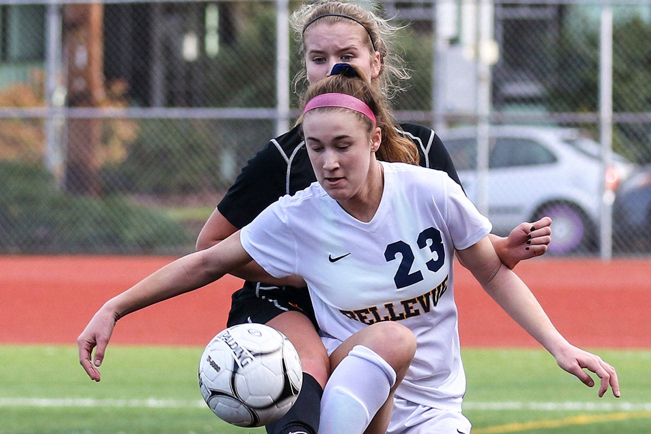 Photo courtesy of Rick Edelman/Rick Edelman Photography                                Bellevue Wolverines senior captain Kiley Suter, right, battles with a Kamiakin player for possession of the ball in the Class 3A state third/fourth place matchup on Nov. 18 at Sparks Stadium in Puyallup.