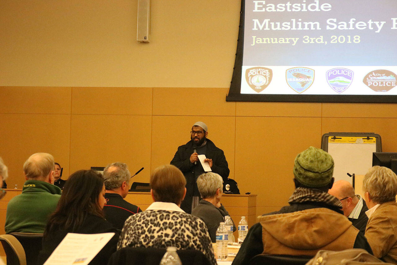 Imam Faisal of the Bellevue Mosque gives a blessing at the start of the Eastside Muslim Safety Forum on Wednesday in Bellevue. Nicole Jennings/staff photo