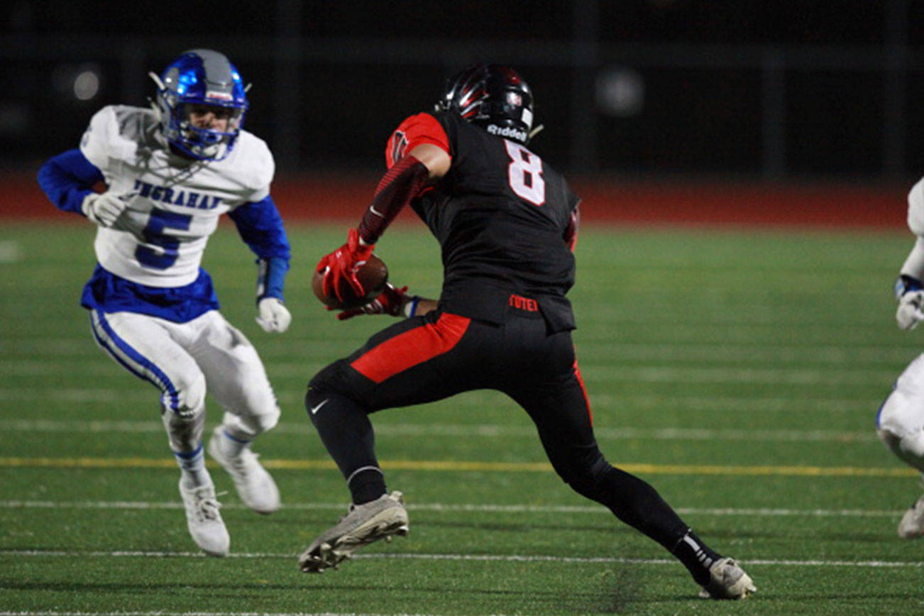 Photo courtesy of Scott Miller                                Sammamish Totems senior Tao McClinton, center, makes a move up the field after making a catch against the Ingraham Rams on Sept. 29. McClinton will continue his football career at Sacramento State University.