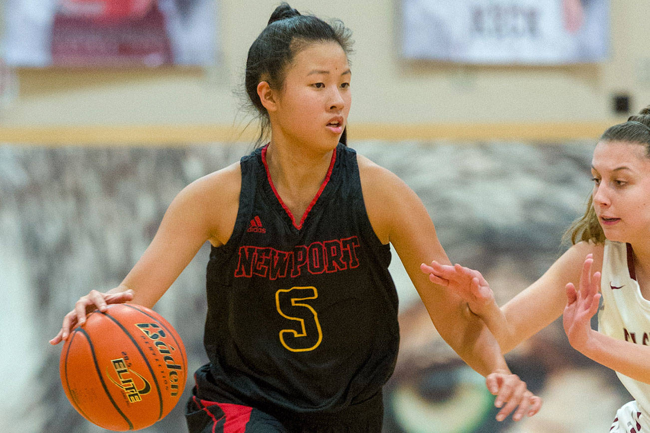 Photo courtesy of Patrick Krohn/Patrick Krohn Photography                                Newport senior Alexa Hsia dribbles the ball upcourt against the Eastlake Wolves on Feb. 1. Hsia is one of the Knights three team captains.
