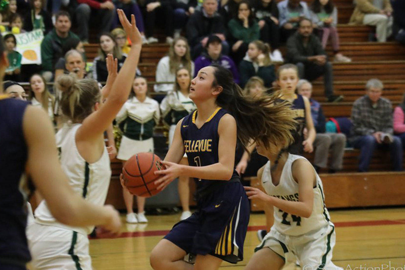 Photo courtesy of Don Borin/Stop Action Photography                                Bellevue Wolverines guard Kara Choi, middle, hit clutch shots from the perimeter throughout the KingCo 3A tournament title game against the Redmond Mustangs on Feb. 7 at Newport High School in Factoria.