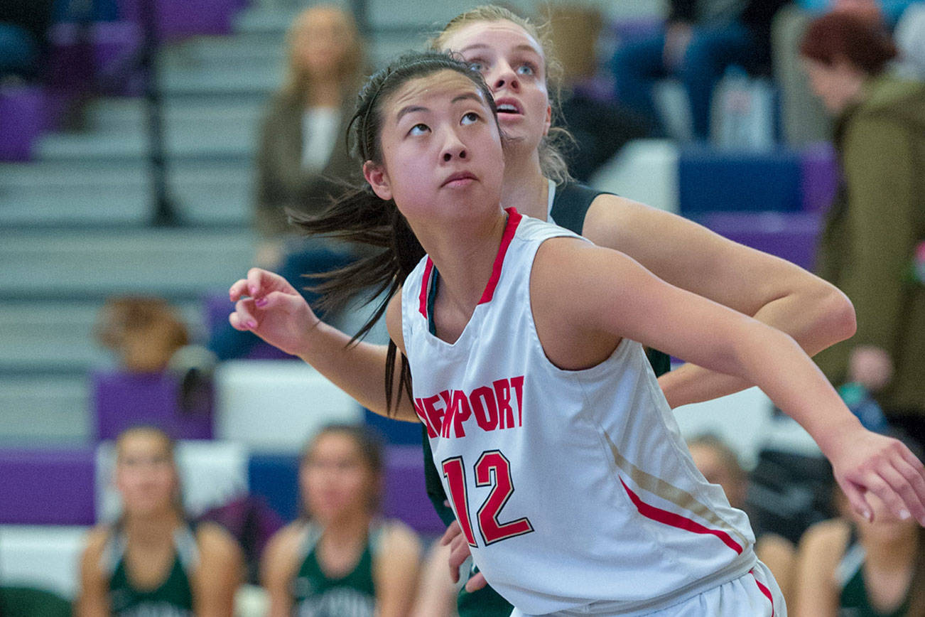 Photo courtesy of Patrick Krohn/Patrick Krohn Photography                                Newport Knights senior Vanessa Hsia, who is one of three team captains, battled for position for a rebound with a Skyline player in a loser-out playoff game on Feb. 15 at Lake Washington High School in Kirkland. Skyline defeated Newport 72-57. The Knights finished the 2017-18 season with an overall record of 14-7.