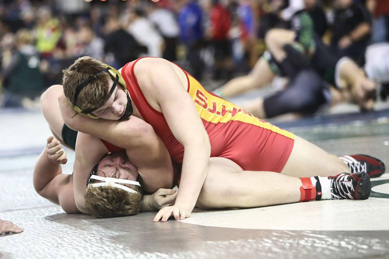 Photo courtesy of Don Borin/Stop Action Photography                                Newport 285-pound senior Charlie Baumann pins Emerald Ridge sophomore Jonah Mains in the first round of the Mat Classic Class 4A 285-pound tournament on Feb. 16. Baumann caught Mains in one of his favorite moves, the head and arm.