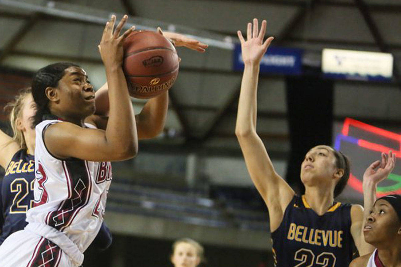 Photo courtesy of Don Borin/Stop Action Photography                                Bellevue Wolverines senior Aubrey Baker (No. 22), right, tries to block a shot against the Bethel Braves in the first round of the Class 3A state playoffs on Feb. 28 at the Tacoma Dome. Bethel defeated Bellevue 55-41 in a loser-out, winner-to-quarterfinals playoff matchup. The Wolverines finished the 2017-18 season with an overall record of 21-6.