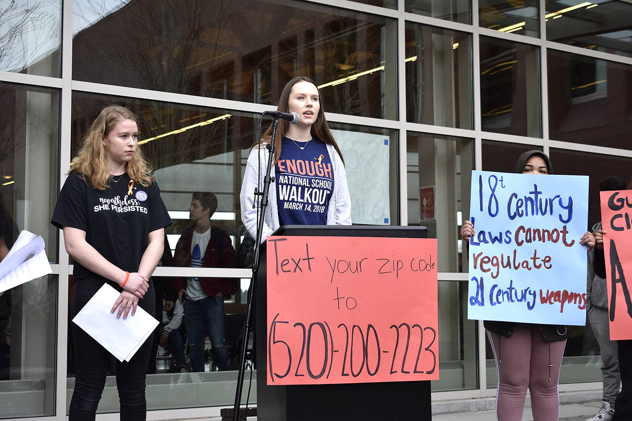 Haley Cook, a Bellevue High School junior, speaks at Bellevue High School’s National School Walkout on March 14. Raechel Dawson/staff photo