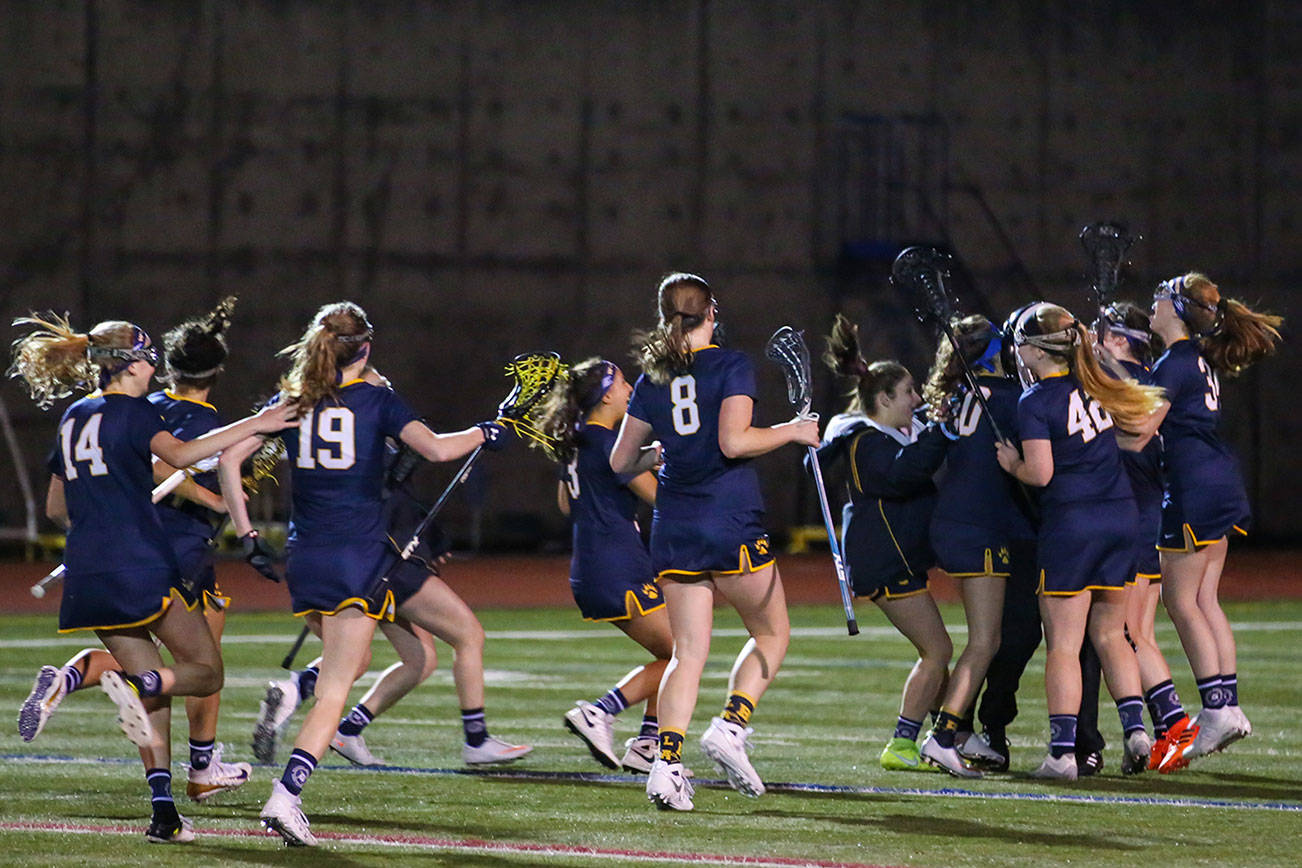 Photo courtesy of Rick Edelman/Rick Edelman Photography                                The Bellevue Wolverines girls lacrosse team celebrates in the immediate moments following their 16-11 victory in the Washington Schoolgirls Lacrosse Association (WSLA) quarterfinals against the Eastside Catholic Crusaders on May 10 in Sammamish.                                Bellevue player Vanessa Rubel scored a game high five goals and had one assist in the win. Kimberly Nickerson and Lily Weingaertner added four goals apiece as well in the victory. Makenzie McGrath scored two goals and Abby Parrish had one goal to round out the scoring. Mindy Weingaertner had a team-high three assists.