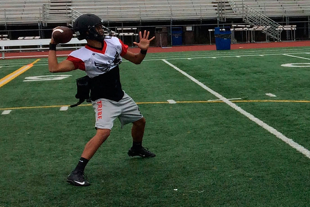 Coby Akana unleashes a pass deep down the sideline to one of his receivers during a spring football practice session on June 8 at Sammamish High School in Bellevue. Shaun Scott, staff photo