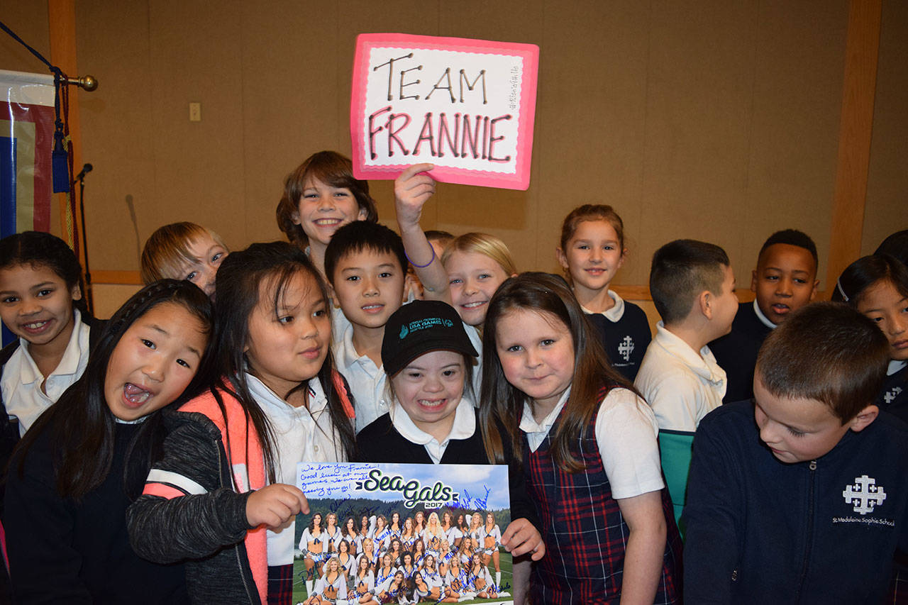 St. Madeleine Sophie Catholic School students surround gymnast Frannie Ronan, center, after she learned of her selection to compete at the 2018 Special Olympics USA Games. Courtesy photo