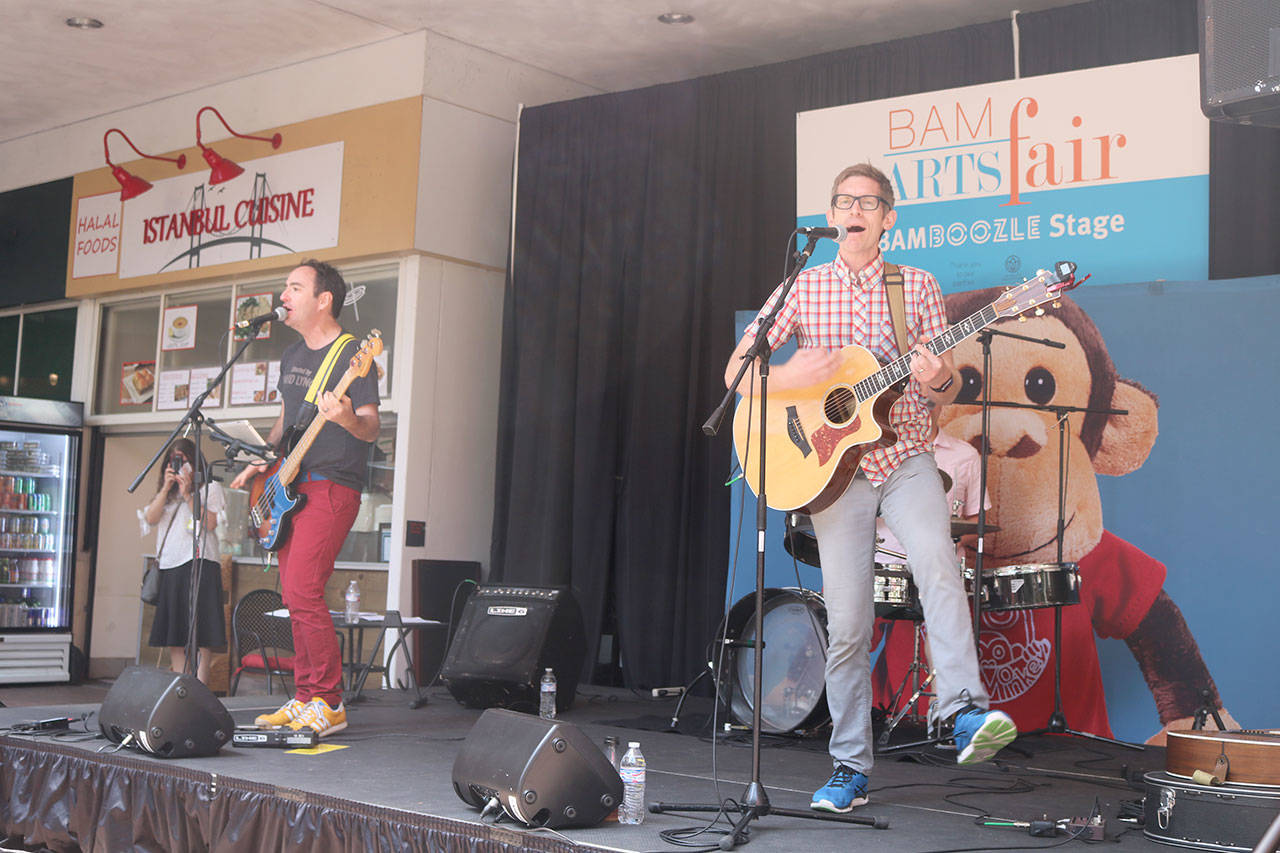 Seattle-based family music band ‘Recess Monkey’ play a show at the kids stage at Bellevue Square. Evan Pappas/staff photo