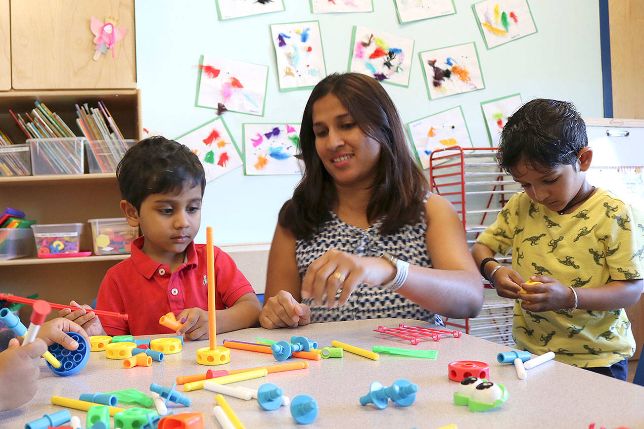 Assistant teacher, Ms. Jyoti prompts questions for the preschoolers. Stephanie Quiroz/staff photo.